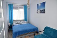 Posteľ alebo postele v izbe v ubytovaní Apartament SanPaulo