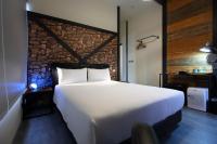 a bedroom with a large white bed and a desk at Ji Ye Jing Zhan B&amp;B in Ji&#39;an