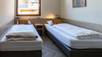 A bed or beds in a room at UplandParcs Silvretta