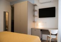 Televízia a/alebo spoločenská miestnosť v ubytovaní Hotel Oliva