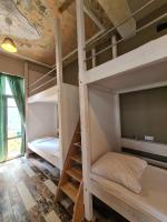 Postel nebo postele na pokoji v ubytování Jetpak Alternative Eco Hostel