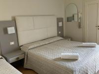 Łóżko lub łóżka w pokoju w obiekcie Hotel Vera