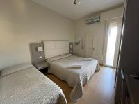 Łóżko lub łóżka w pokoju w obiekcie Hotel Vera