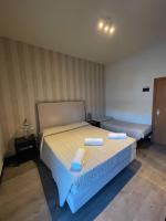 Łóżko lub łóżka w pokoju w obiekcie Hotel Vera