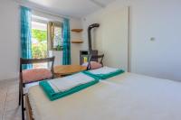Posteľ alebo postele v izbe v ubytovaní Apartmani Azur