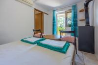 Posteľ alebo postele v izbe v ubytovaní Apartmani Azur