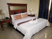 Ras Dika Hotelにあるベッド