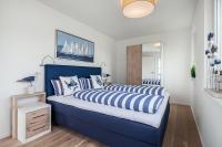 Postel nebo postele na pokoji v ubytování NordseeResort Büsum Ferienhaus 1 Beach House