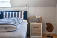 Postel nebo postele na pokoji v ubytování NordseeResort Büsum Ferienhaus 1 Beach House