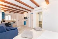 A television and/or entertainment centre at CASA AZUL - Boutique Apartments by Casa del Patio