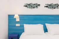 A bed or beds in a room at CASA AZUL - Boutique Apartments by Casa del Patio