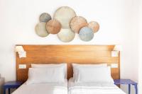 A bed or beds in a room at CASA AZUL - Boutique Apartments by Casa del Patio