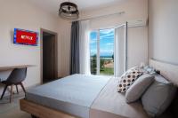 Postel nebo postele na pokoji v ubytování Megali Beach Nikos