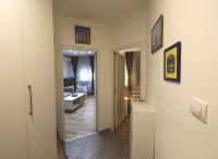 a hallway leading to a room with a living room at TOP Apartman in Šabac