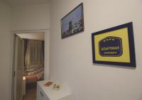 a living room with two pictures on the wall at TOP Apartman in Šabac