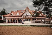 a large white building with a roof at Pension Zwicker in Prešov