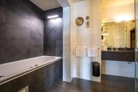Een badkamer bij Fletcher Hotel-Restaurant Arion-Vlissingen