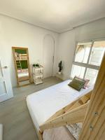 Posteľ alebo postele v izbe v ubytovaní Apartamento en 1ª línea con piscina