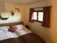 A bed or beds in a room at Kranach 5 - Wohnen beim Wein