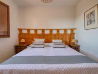 Postel nebo postele na pokoji v ubytování Holiday Home Masirope by Interhome