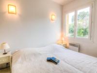 Una cama o camas en una habitaci&oacute;n de Apartment Riva Bella-3 by Interhome