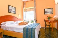 Łóżko lub łóżka w pokoju w obiekcie Hotel Villa Fernanda