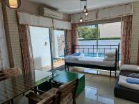 Posezení v ubytování AMARA Pool Villa at Boulevard Tuscany ChaAm HuaHin