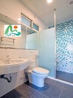 a bathroom with a toilet and a sink and a shower at 3520 Homestay in Taitung City