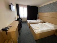 Postel nebo postele na pokoji v ubytování Hotel Zebetinsky Dvur Brno