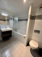 a bathroom with a toilet and a sink and a tub at 501 - Charmant studio dans un immeuble Paris 5 in Paris