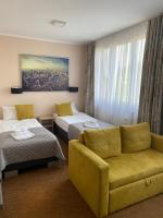 Posteľ alebo postele v izbe v ubytovaní Carina Hotel