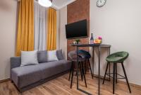 Televízia a/alebo spoločenská miestnosť v ubytovaní Apartments Piccola Venezia