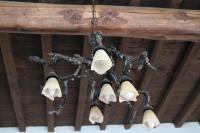 a chandelier is hanging from a wooden ceiling at TRADITIONAL HOUSE MARIA in Azoyirás