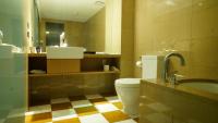 a bathroom with a toilet and a sink at City Suites-Taipei Nanxi in Taipei
