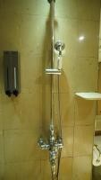 a shower in a bathroom with aaucet at City Suites-Taipei Nanxi in Taipei