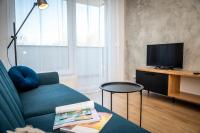 Televízia a/alebo spoločenská miestnosť v ubytovaní Apartamenty Przy IV Śluzie - LUX 50m2