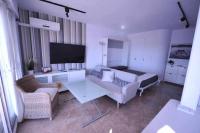 Televízia a/alebo spoločenská miestnosť v ubytovaní Atico Apartamento Loft Playa Victoria Cadiz