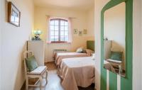 Łóżko lub łóżka w pokoju w obiekcie Villa Lavandaia Toscana