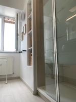 a glass shower in a bathroom with a window at Le Metz, Duplex, 2 Chambres in Le Touquet-Paris-Plage