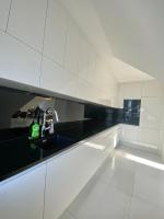 Kuchyňa alebo kuchynka v ubytovaní Penthouse 2 Bedroom Designer Apartment