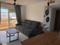 Posedenie v ubytovaní Encantador ático con chimenea y piscina en Almería