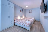 Postel nebo postele na pokoji v ubytování Daisy - 3 Room and kitchen apartment in Lazur