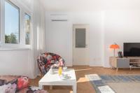 Televízia a/alebo spoločenská miestnosť v ubytovaní Apartment Tana