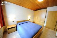 Łóżko lub łóżka w pokoju w obiekcie Appartamento MilHouse by Livigno Accomodation