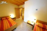 Łóżko lub łóżka w pokoju w obiekcie Appartamento MilHouse by Livigno Accomodation