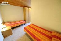 Łóżko lub łóżka w pokoju w obiekcie Appartamento MilHouse by Livigno Accomodation