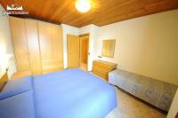Łóżko lub łóżka w pokoju w obiekcie Appartamento MilHouse by Livigno Accomodation