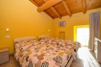 A bed or beds in a room at Casa nel Borgo - Il Gufo