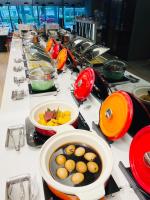 a buffet line with plates and bowls of food at Sonnien Hotel in Taipei