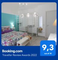 A bed or beds in a room at La Casetta di Meta